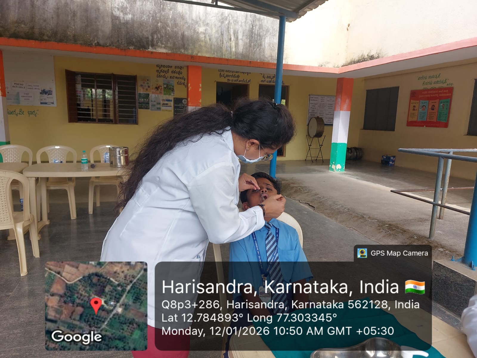 Dentist performing a dental procedure on a young patient