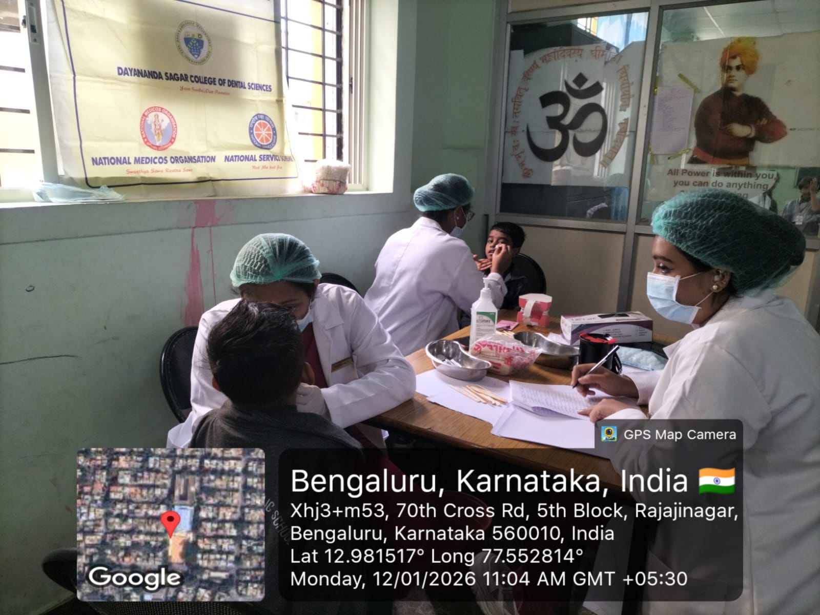 Dental professional consulting with a patient during the screening camp
