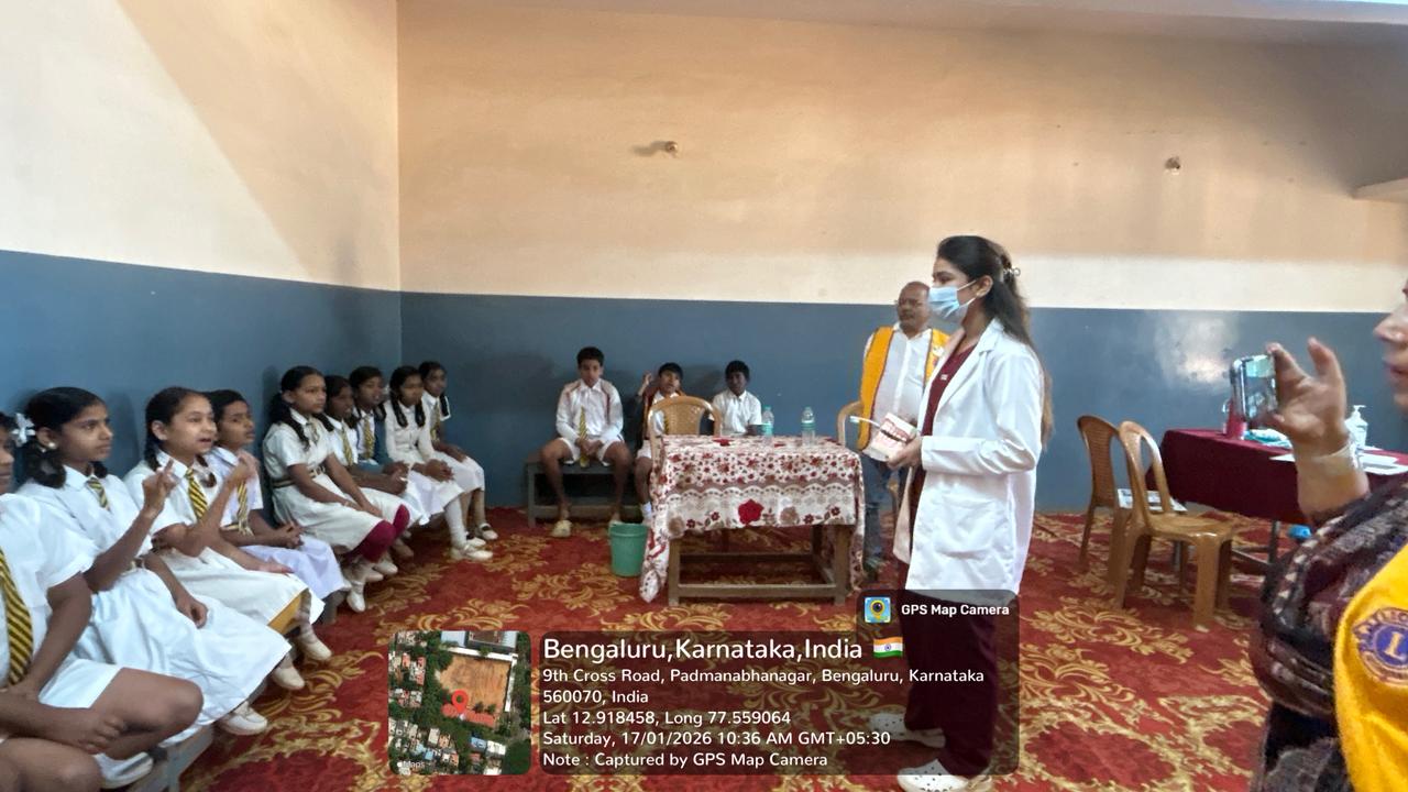 Dentist demonstrating oral hygiene to students