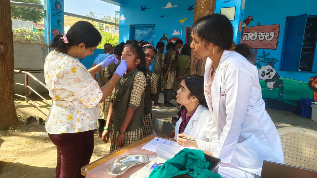 Dental team conducting an oral health education session in a classroom
