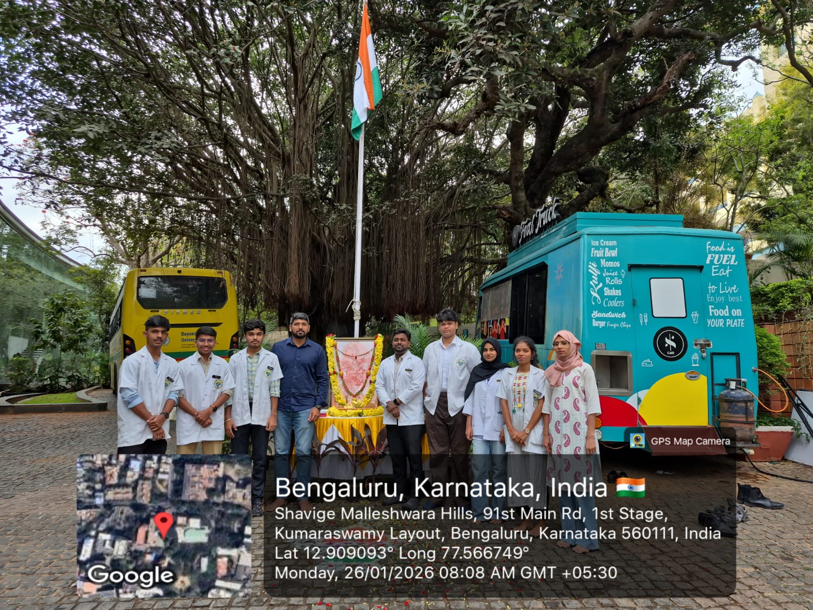 Faculty members and dental students gathered in front of the national flag