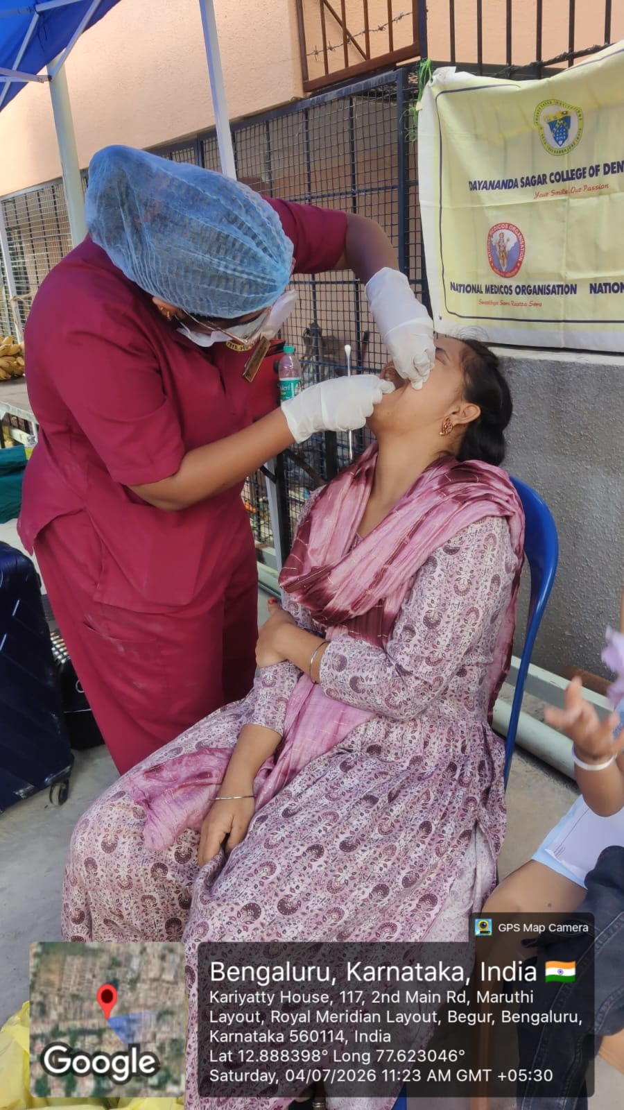Dentist performing a dental procedure on a female patient