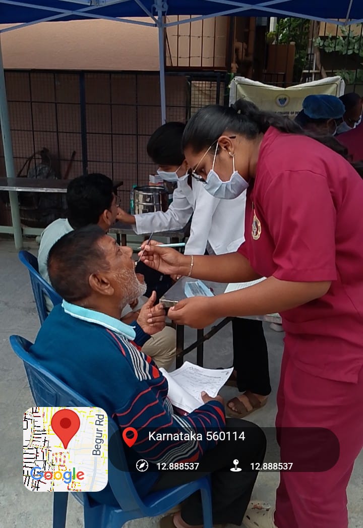Dentist examining a male patient's teeth