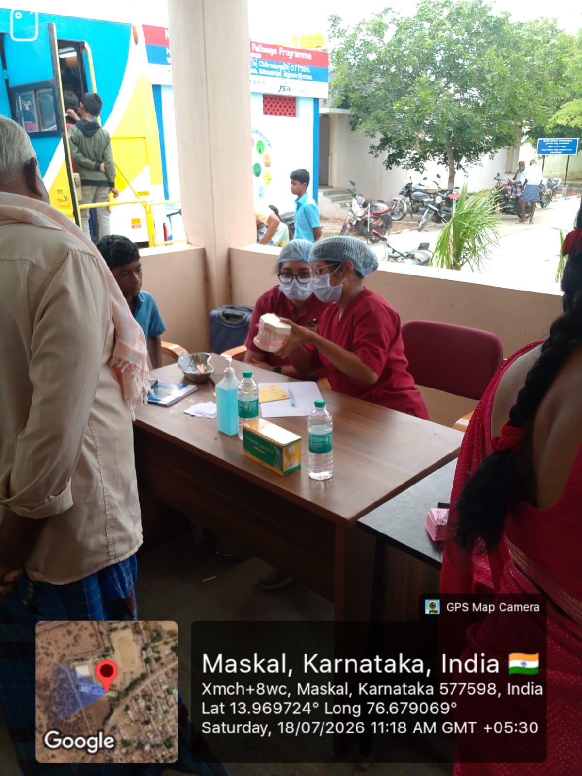 Dental professional conducting an oral screening for an adult female